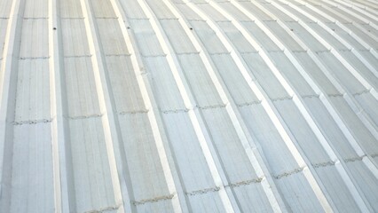 Close up a white pattern metallic roof top of a building for backkground texture