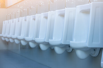 White urinals with white in the men toilet,Male restroom, Male toilet wall hung urinal.