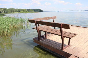 Fototapeta na wymiar bench spot at lake pier