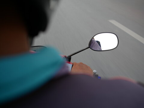 Motorcycle Rearview Mirror On The Road.