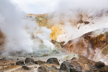 Volcanic landscape, crater of active volcano: hot spring, fumarole, lava field, gas-steam activity....