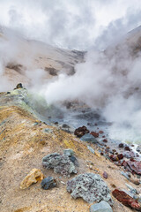 Mountain landscape, crater of active volcano: fumarole, hot spring, lava field, gas-steam activity. Dramatic volcanic landscape, popular travel destinations for active vacation, mount climbing, hiking