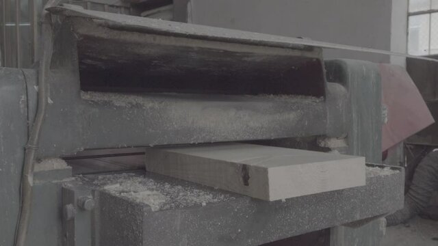 carpenter is cutting a wooden plank. Ungraded S-log 3 Prores 422 HQ with ambiance sound