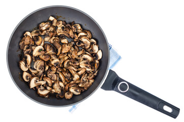 Sliced champignons fried in pan isolated on white background.