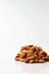 Natural organic almonds nuts heap Isolated on a white background is useful to help neutralize free radicals, help prevent Alzheimer's disease, helping repair the wear and tear on body healthy food.