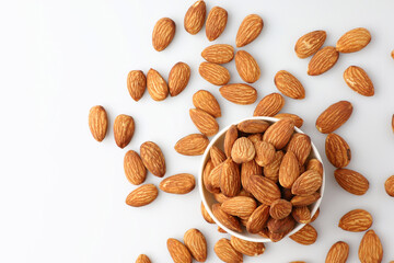 Almonds nut seed in white bowl flat lay top view heap on white background with copy space on the left. Snack whole healthy food is useful to help neutralize free radicals and provide energy.