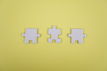 Incomplete Jigsaw puzzle pieces background concept copy space