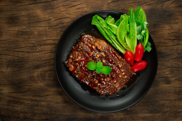 BBQ Pork Ribs with Sauce served Vegetable and tomatoes European Food