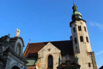The Roof And Spires Of The Ancient Church Against The Backdrop Of An Almost Cloudless Blue Sky.