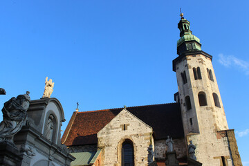 The Roof And Spires Of The Ancient Church Against The Backdrop Of An Almost Cloudless Blue Sky.