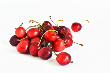 Naklejka na ściany i meble Juicy, ripe sweet cherries on a white background. The concept of food, vitamins.
