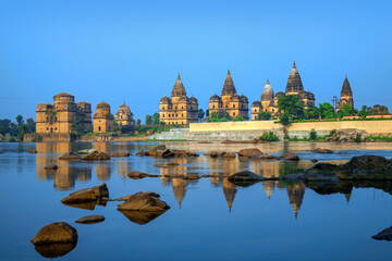 View of Royal cenotaphs (Chhatris) of Orchha over Betwa river. Orchha, Madhya Pradesh, India.