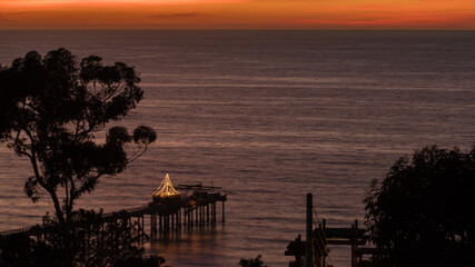 Fototapeta na wymiar Sunset at La Jolla city with Christmas light