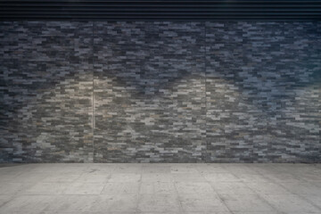 Empty stone pavement and brick wall background