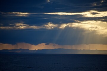 The coast of Japan is far above the horizon. Islands in the sea. Fall.