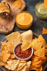 Close-up snacks and chips with salsa or dip for potato or pita chips