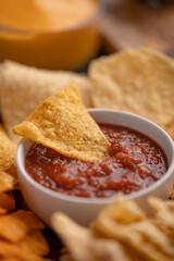 Close-up snacks and chips with salsa or dip for potato or pita chips