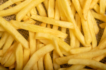 French fries scattered surface texture. Close up.