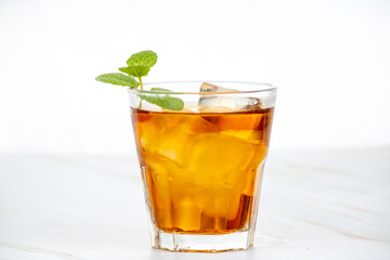 A strong drink with ice and mint