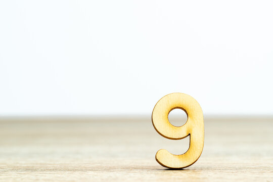 Wooden numeric on table ,number nine