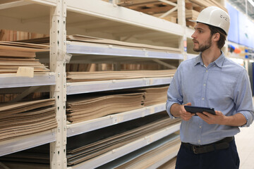 Portrait of a smiling warehouse keeper at work.