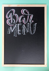 Blank blackboard with wooden frame and chalk inscription. Bar menu.