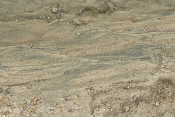 Texture and pattern on the ground made after river water flows