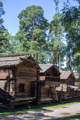 Fototapeta na wymiar Seurasaari Open-Air Museum a district in Helsinki, Finland, which consists of old, mainly wooden buildings transplanted from elsewhere in Finland and placed in the dense forest landscape of the island
