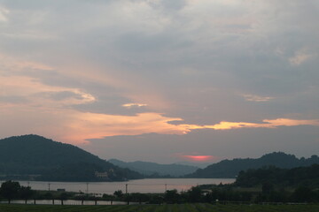 Thai vineyards during sunset with mountain and river view.