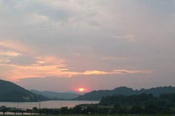 Fototapeta na wymiar Thai vineyards during sunset with mountain and river view