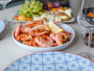 Large shrimp with lemon on the table