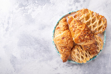Fresh bakery pastry on a plate with text space. Top view