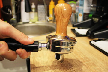 hand of a man working on a bar