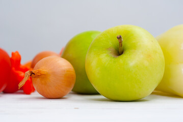 fruits and vegetables on white wood table