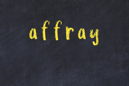 College chalk desk with the word affray written on in