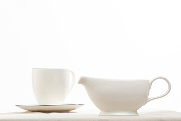white cup and saucer