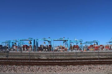 Blue cranes at the APM container terminal in the Maasvlakte Harbor in the Port of Rotterdam.