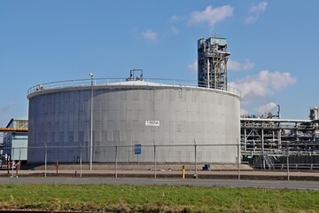 Fototapeta na wymiar Oil and chemical tanks at the terminal of Koole in the Botlek Harbor of Rotterdam.