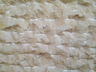 Sandstone wall structure, arbitrary masonry, close-up.