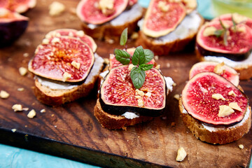 Bruschetta or ctostini with cottage cheese, figs and honey.