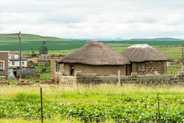 typical rural village houses in South African farm landscape of Kwazulu Natal