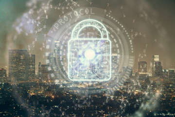 Lock icon hologram on city view with skyscrapers background multi exposure. Data security concept.