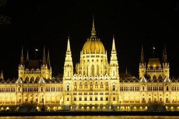Obraz na płótnie Canvas Night view of National Assembly in Budapest, Hungary.
