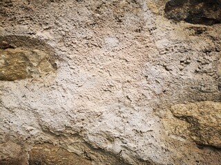 Mauer verputzt mit Narursteinen