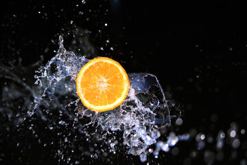 Fototapeta na wymiar Fresh and fruity orange water splash