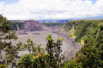 Panoramic view from edge of Kilauea Iki Volcano crater and caldera with lava rock flow field and...