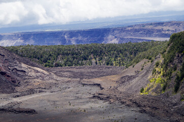 Panoramic view from edge of Kilauea Iki Volcano crater and caldera with lava rock flow field and...