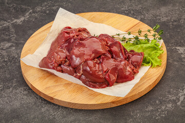 Raw chicken liver over board