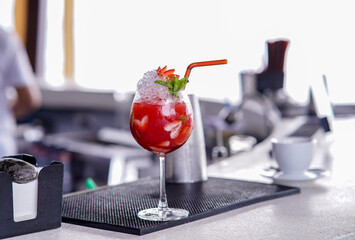 Strawberry Daiquiri Cocktail with plastic straw, cocktail in the bar