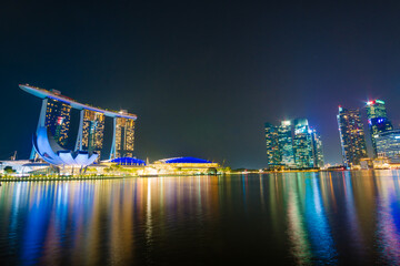 Beautiful architecture building skyscraper around marina bay in singapore city at night